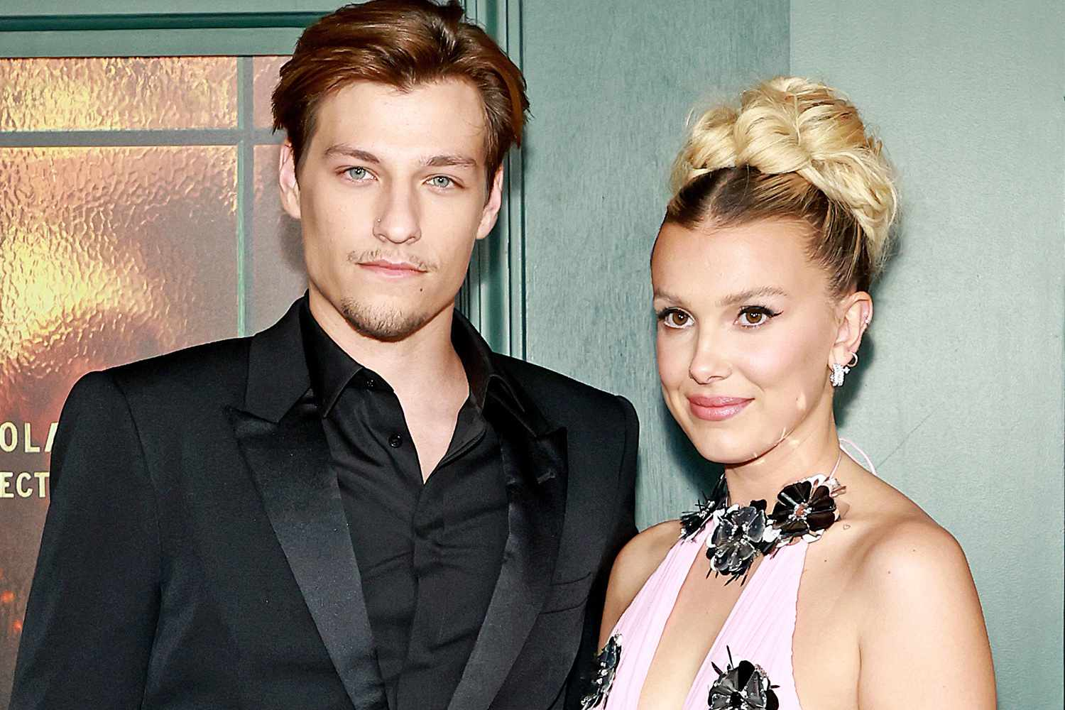 Millie Bobby Brown and Jake Bongiovi smiling together at an event.